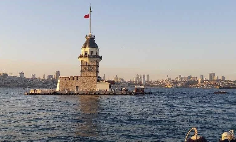 A colorful sunset view with the Maiden’s Tower in the background in the Bosphorus