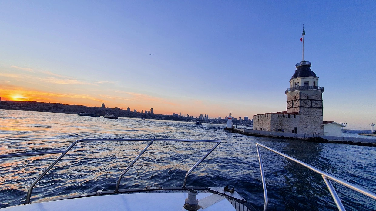 the sunset against the Maiden’s Tower from a luxury yacht in the Bosphorus