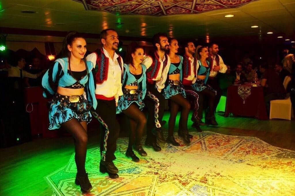 A group performing a  show on the Istanbul Dinner Cruise.